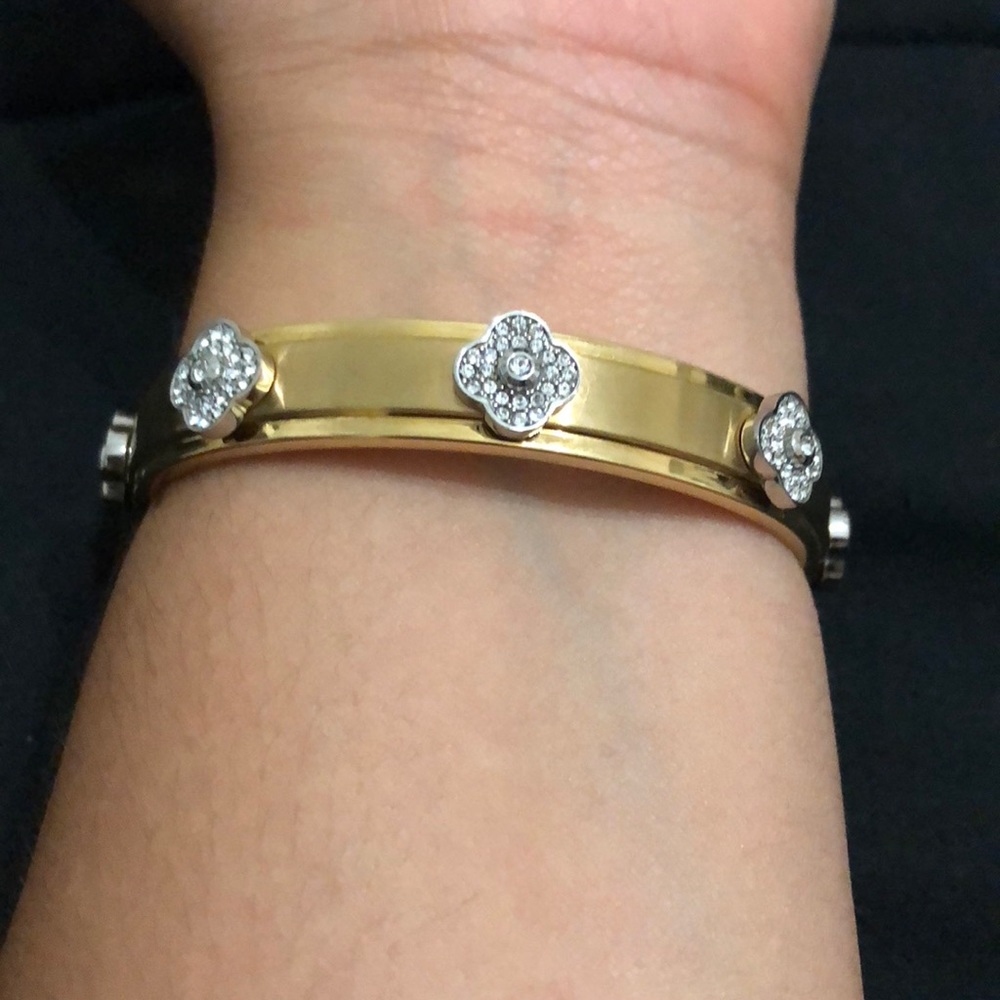 Henri Bendel metallic flower accent cuff